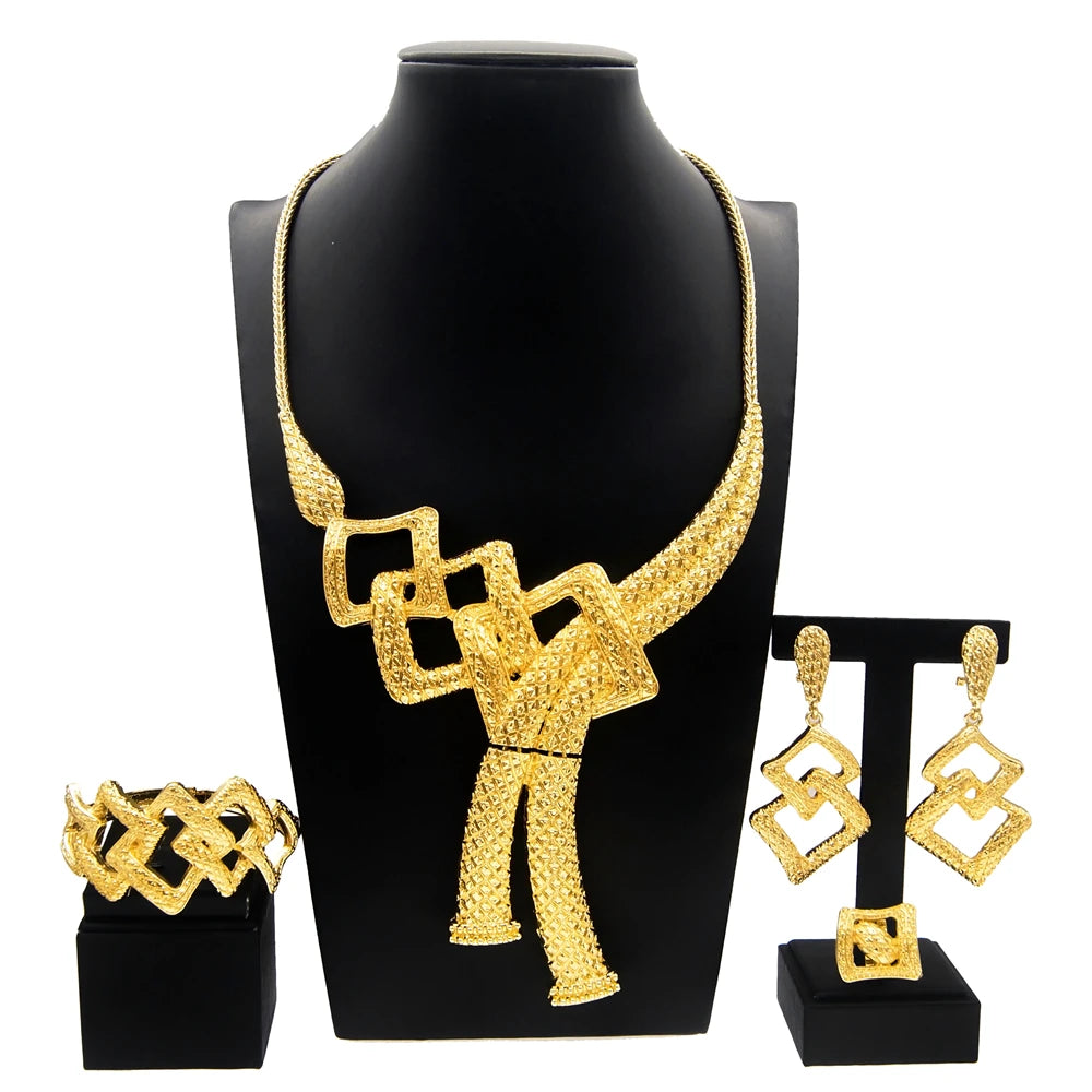 Gold plated Dubai jewelry set by LAQTA featuring intricate design with earrings and matching necklace on a white background.