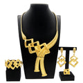 Gold plated Dubai jewelry set by LAQTA featuring intricate design with earrings and matching necklace on a white background.