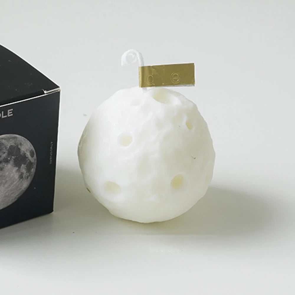 LAQTA creative lunar-shaped scented candles in a soft, glowing display with a moon design and warm candlelight ambiance.