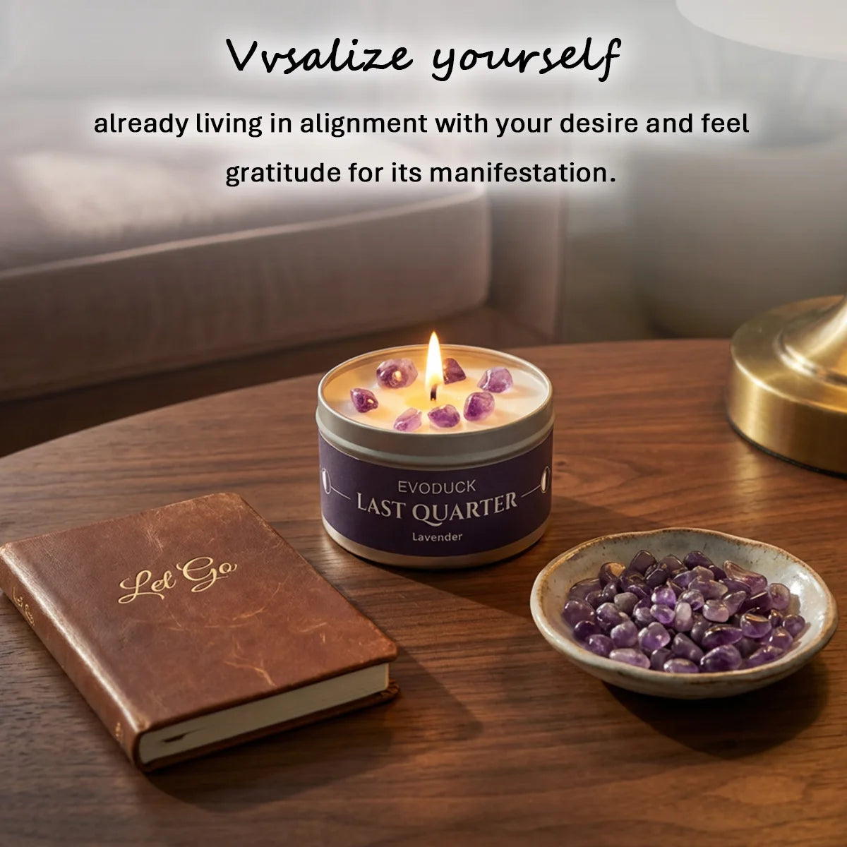 LAQTA Waning Moon scented candle with a soft glow, featuring a crescent moon design on a dark-colored wax surface.