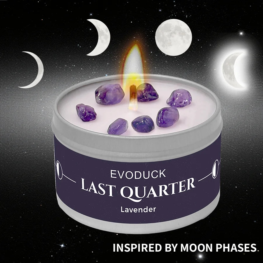 LAQTA Waning Moon scented candle in a glass jar with a warm, glowing flame and moon phase design on the label.