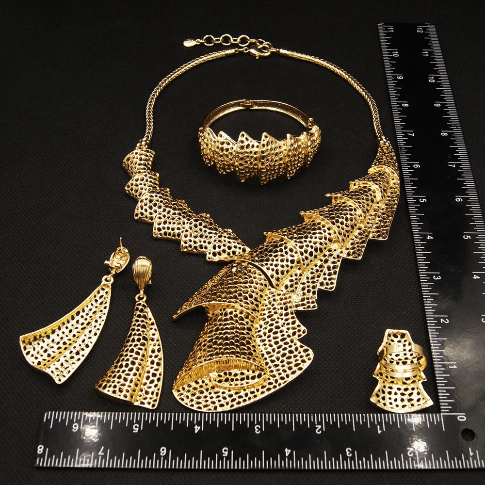 Elegant woman's jewelry by LAQTA featuring intricate designs and shiny gold-tone accessories for fashionable style.