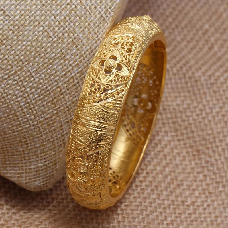 LAQTA 24k Dubai gold color bangles featuring intricate design and shiny gold finish, perfect for traditional and festive wear.
