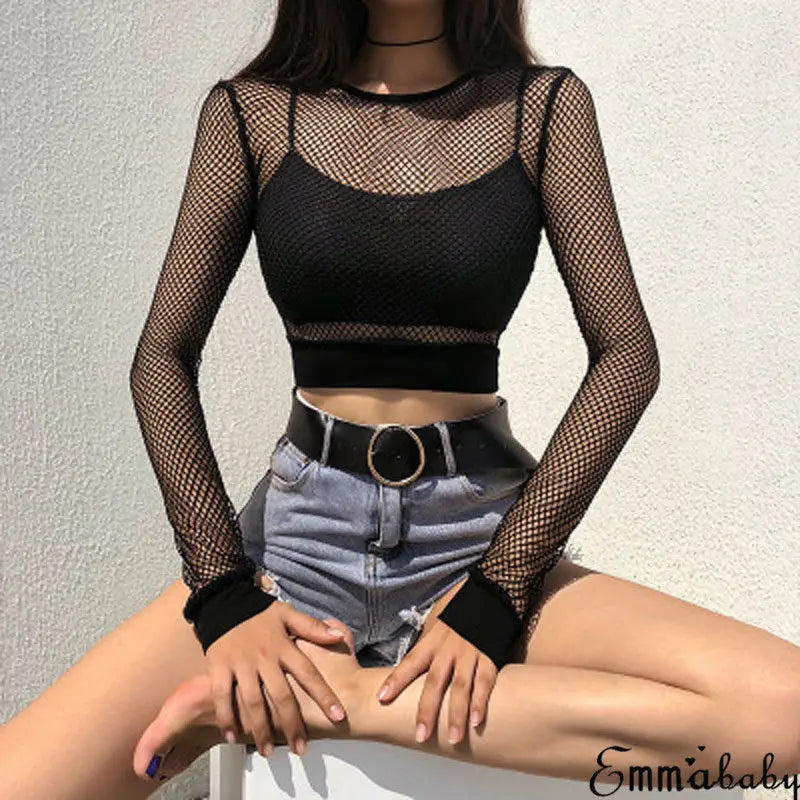 Black hollow-out mesh bodysuit by LAQTA featuring sheer fabric and cut-out details, form-fitting and stylish for bold fashion looks.