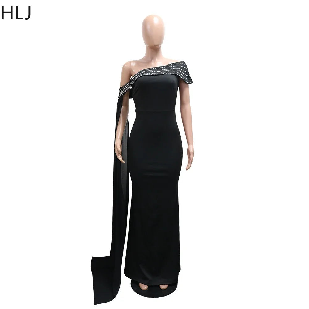 Sexy rhinestone patchwork bodycon long dress by LAQTA featuring a fitted silhouette and sparkling embellishments.