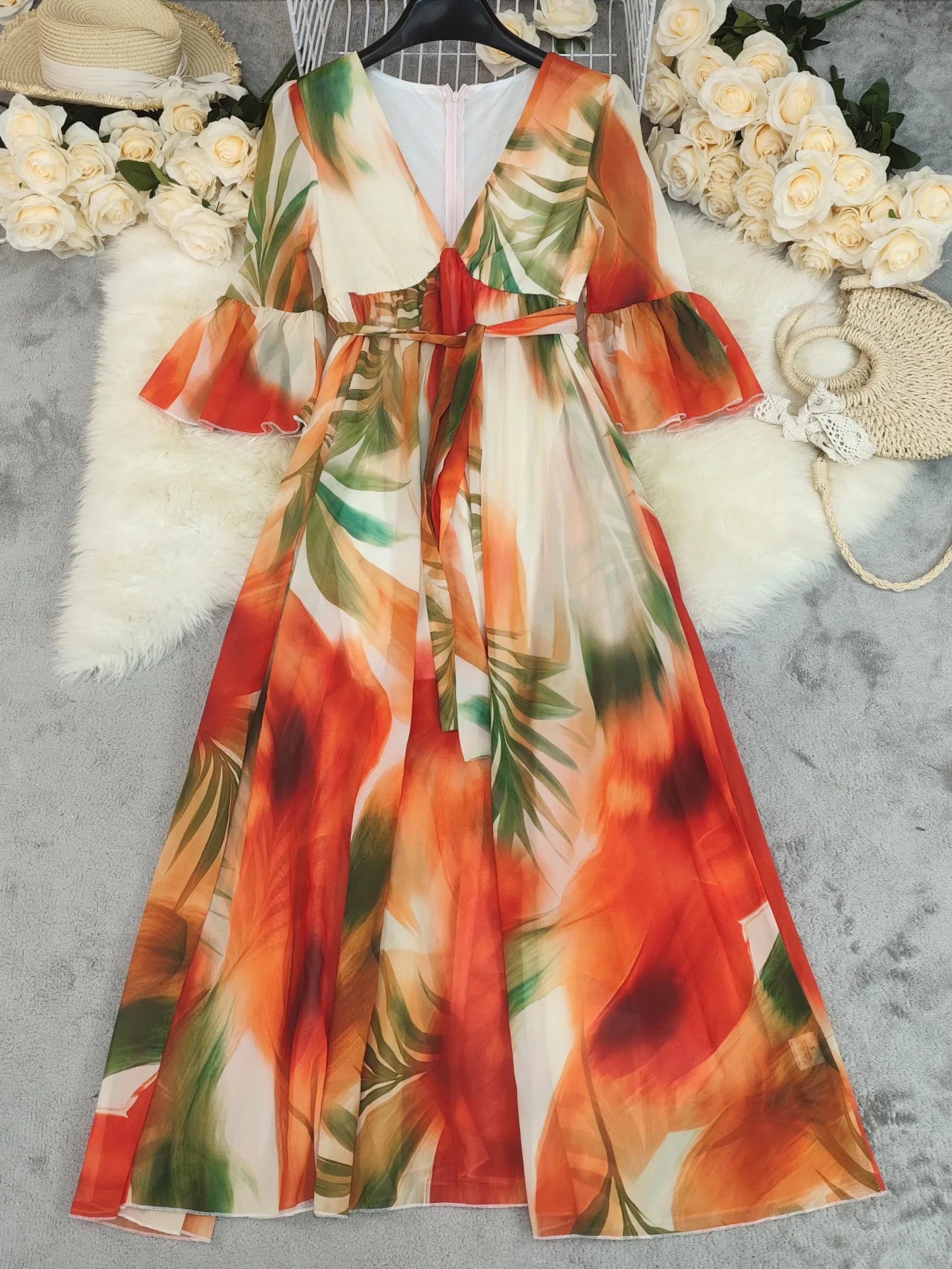 Elegant long women's dress by LAQTA featuring a flowing silhouette and stylish design, shown in a full-length view.