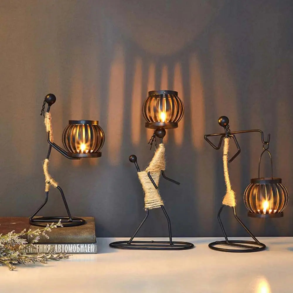 Nordic-style metal candlestick by LAQTA with a sleek, minimalist design and a tall, slender shape on a wooden surface.