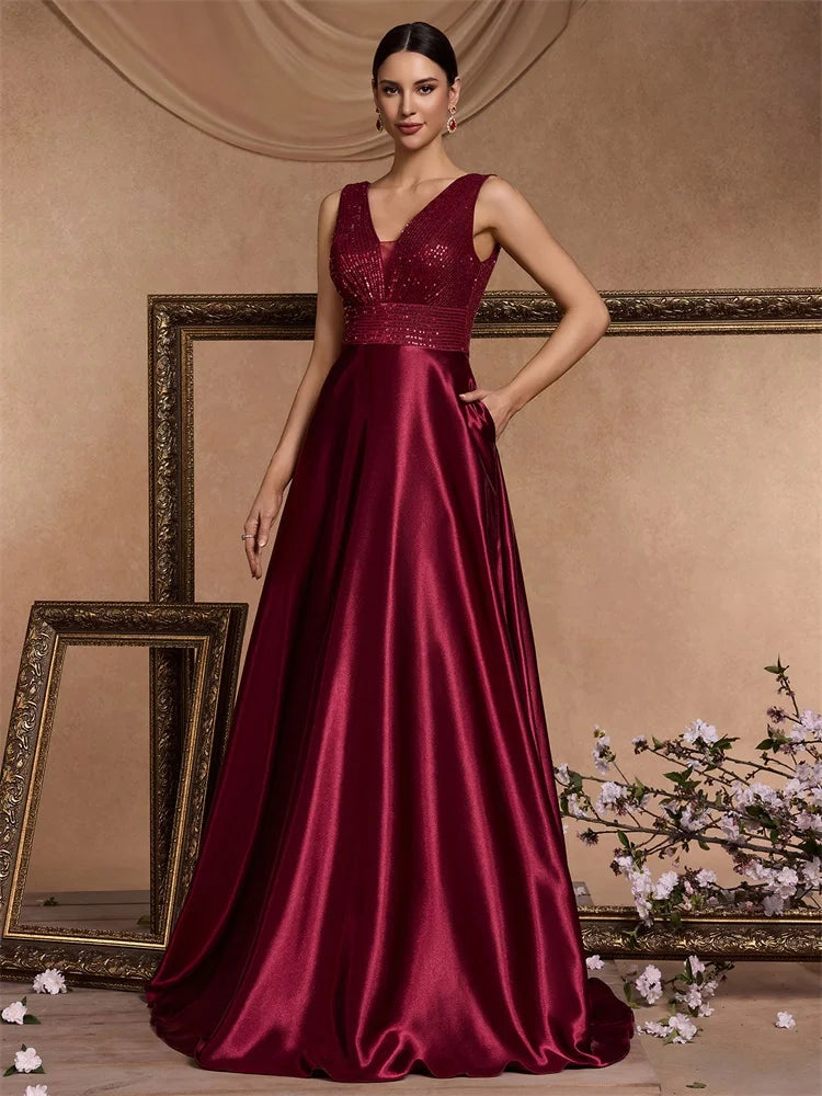 Elegant sequins evening dress by LAQTA featuring a fitted silhouette and shimmering embellishments for formal occasions.