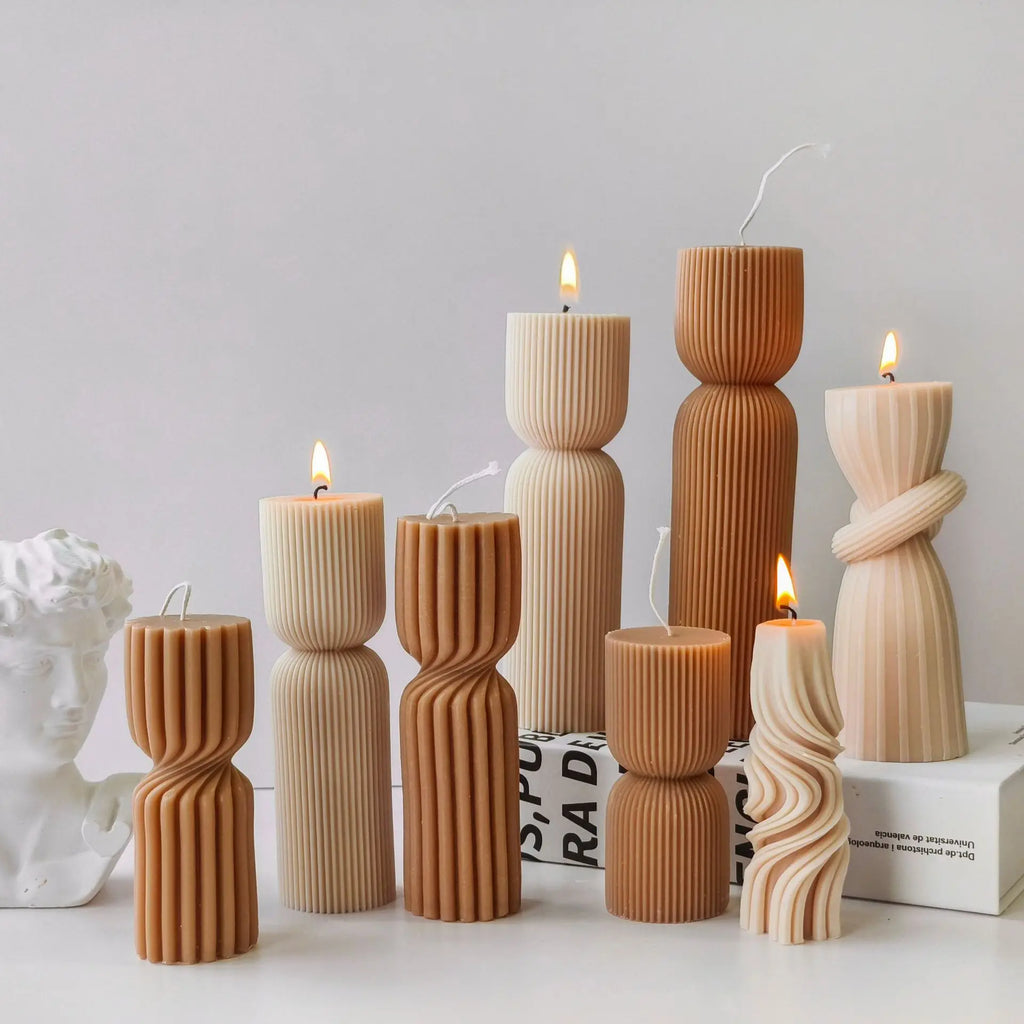 Striped cylinder aroma candle silicone mold by LAQTA, showing the detailed striped design and flexible silicone texture.