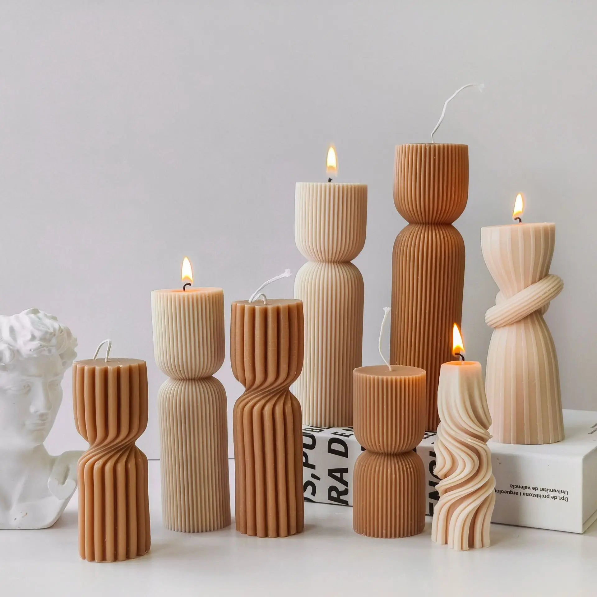 Striped cylinder aroma candle silicone mold by LAQTA, showing the detailed striped design and flexible silicone texture.