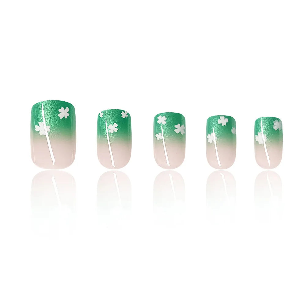 Set of 24 short square-shaped acrylic nails by LAQTA, displayed on a white background with various nail designs.