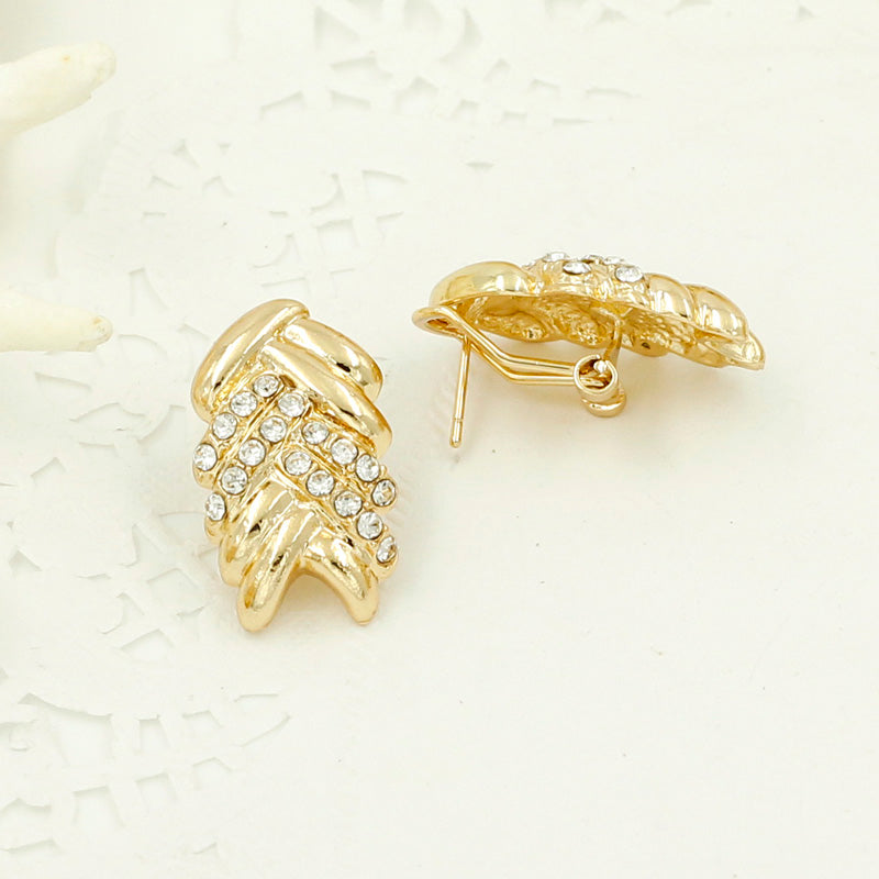 Elegant gold-colored bridal fashion jewelry by LAQTA, featuring intricate designs perfect for Dubai wedding attire.