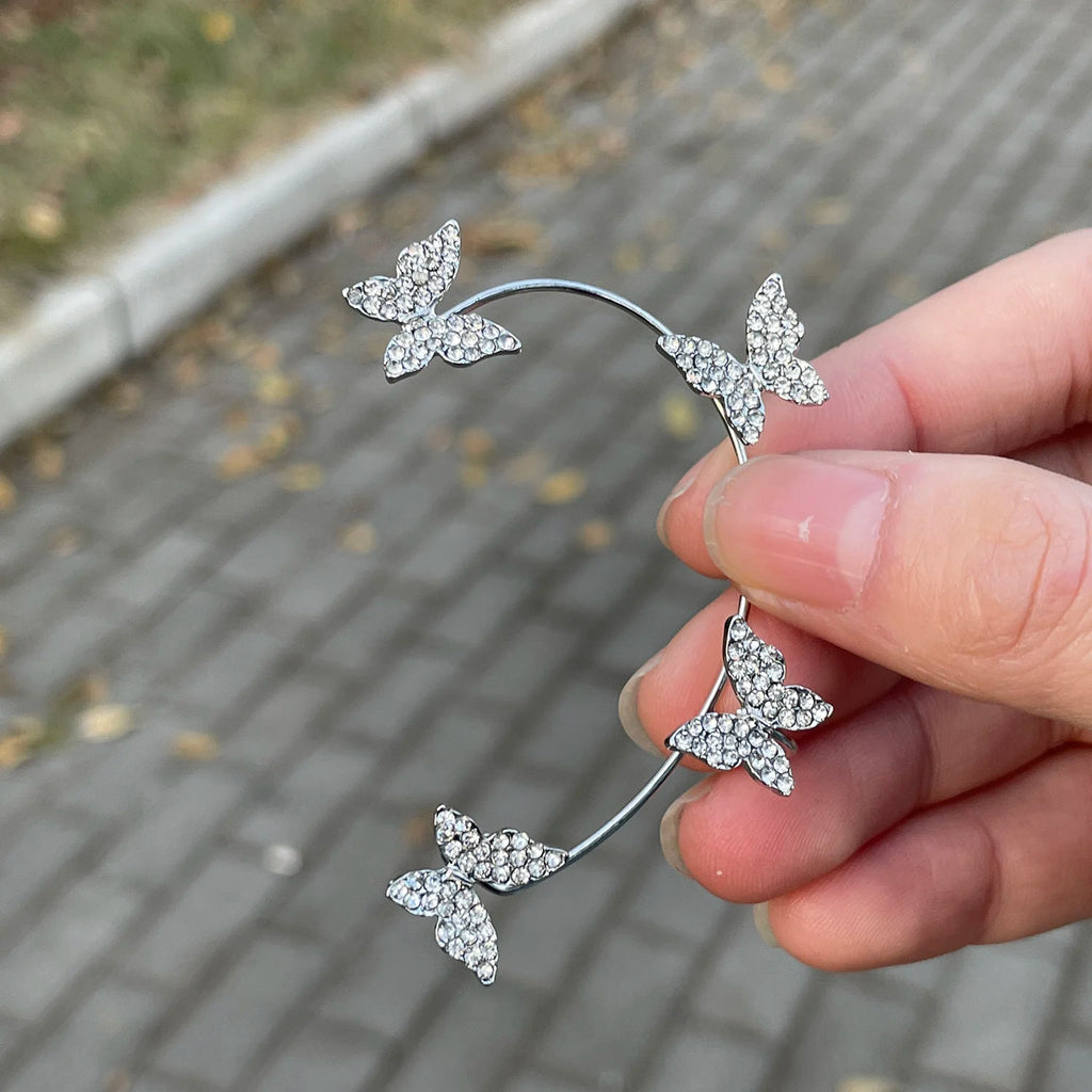 Korean style butterfly ear clips by LAQTA featuring delicate gold-toned butterfly designs on a white background.