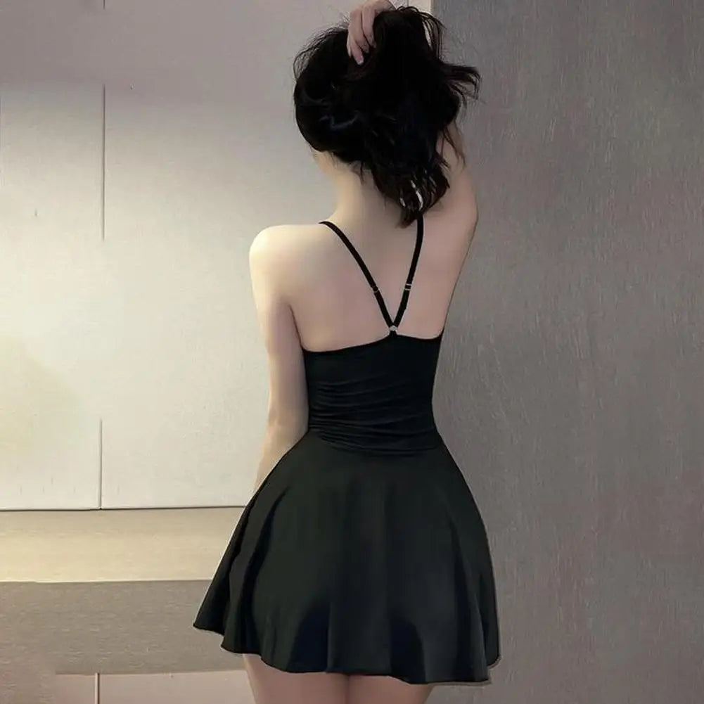 LAQTA pleated micro dress shown in the image, featuring a fitted silhouette with pleated fabric for a stylish and modern look.