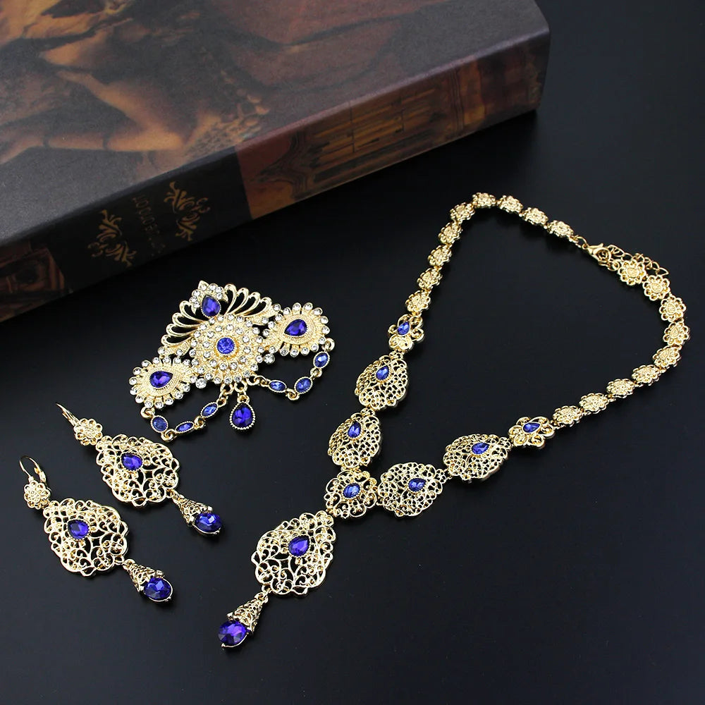 Elegant Moroccan bride jewelry by LAQTA featuring intricate gold and gemstone details for traditional wedding attire.