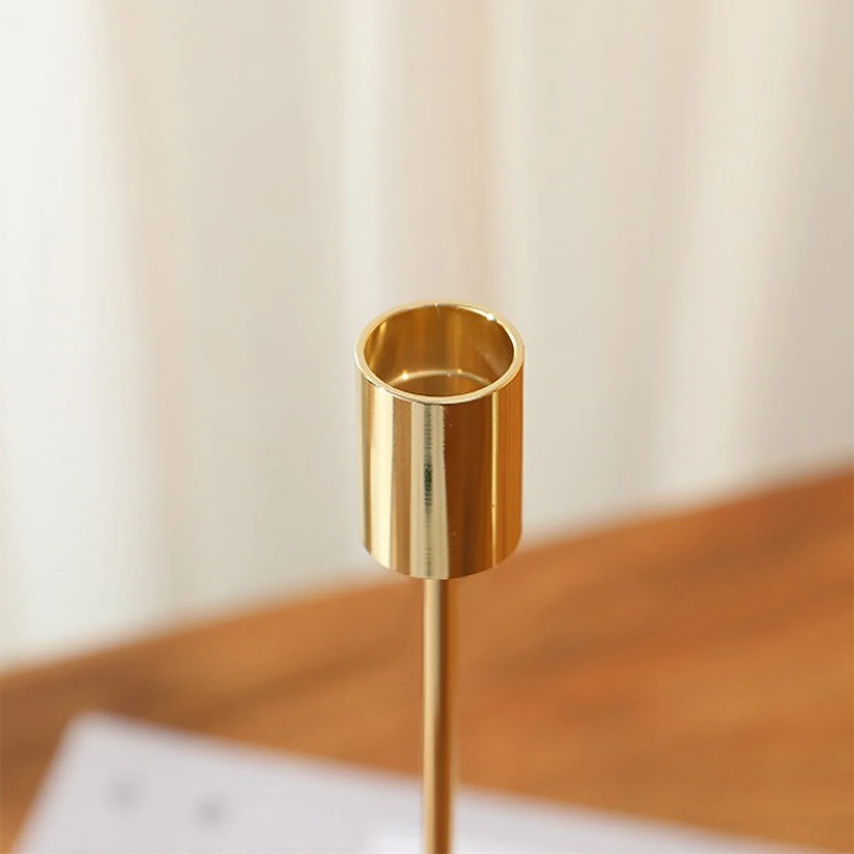 Elegant gold candlestick holder by LAQTA with a sleek design, perfect for enhancing table settings or decor.