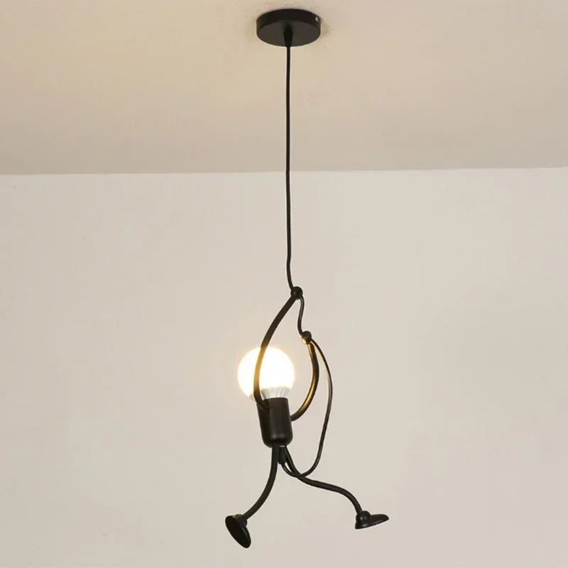 Vintage iron Little Man pendant lights by LAQTA featuring a whimsical design, perfect for rustic or industrial decor.