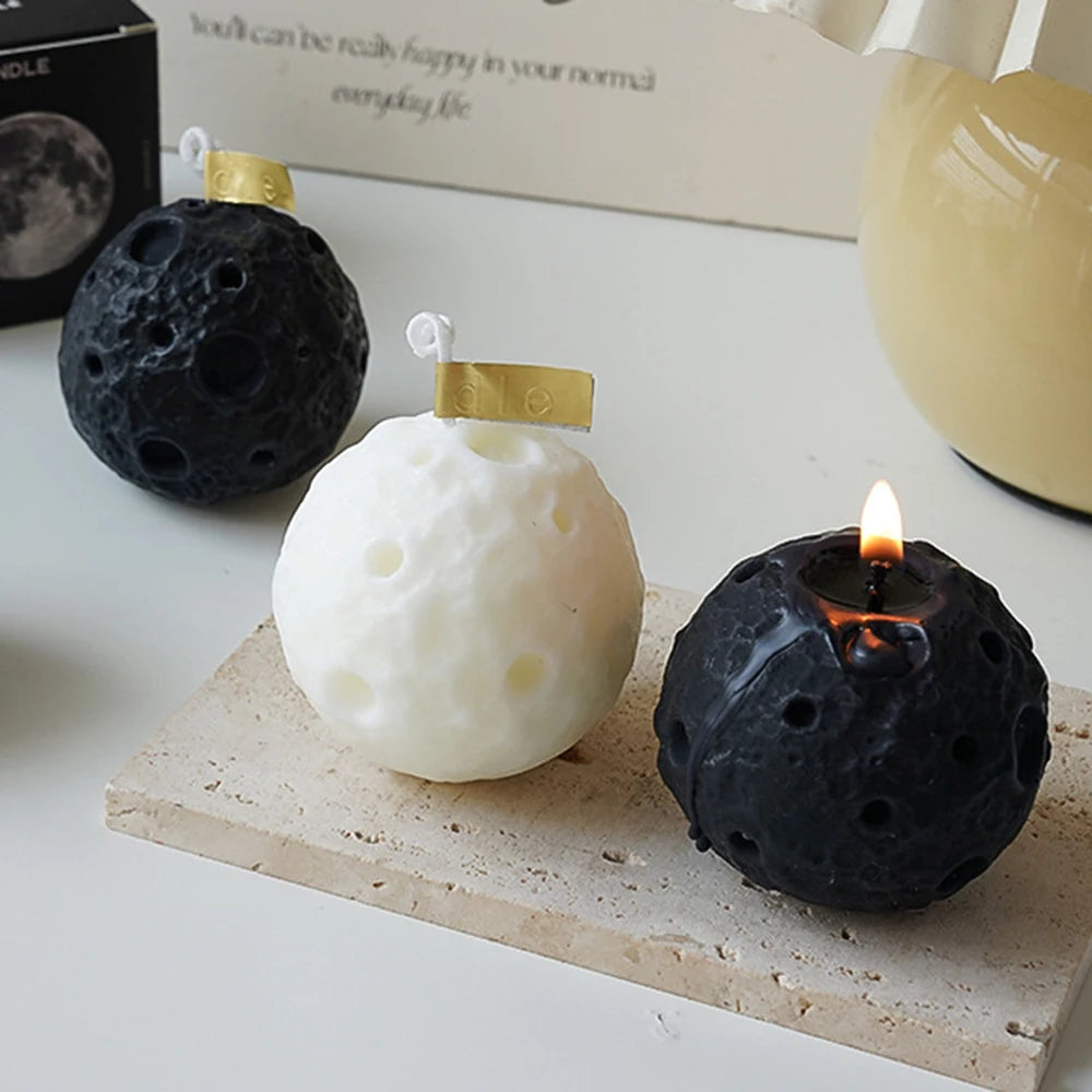LAQTA lunar shape scented candle with a textured surface, showcasing a creative moon-inspired design in soft, warm lighting.
