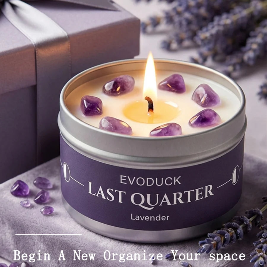 LAQTA Waning Moon scented candle in a glass holder with a soft, glowing flame and a moon-themed design on the label.
