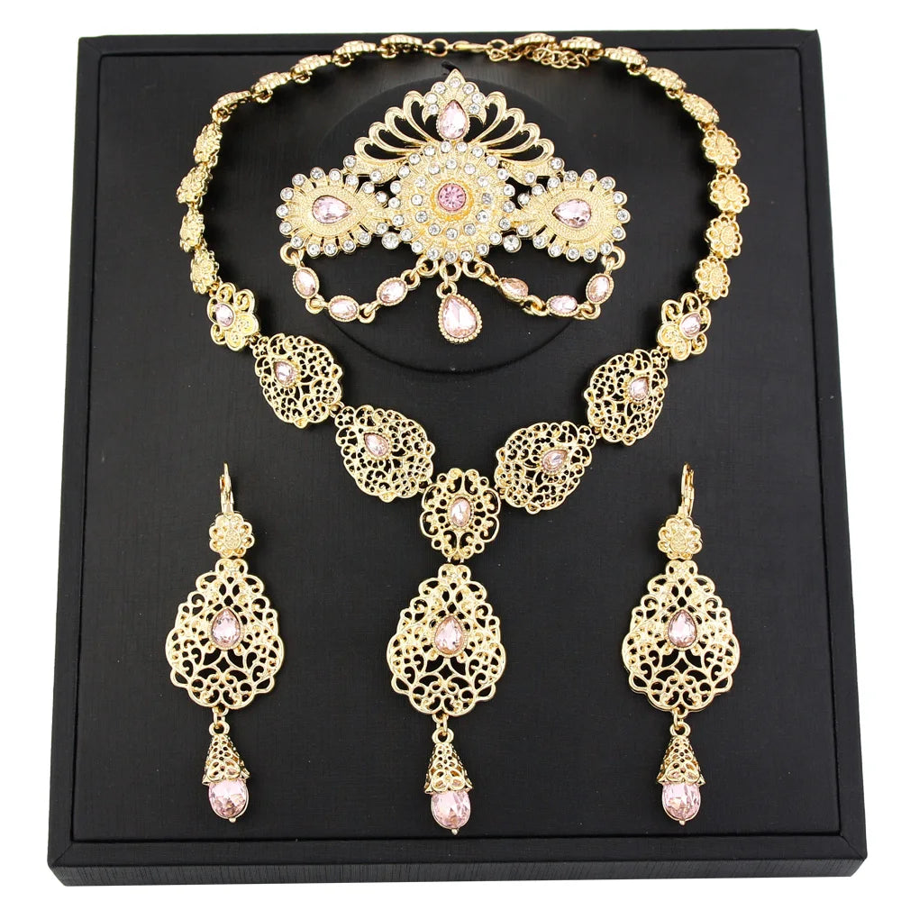 Elegant Moroccan bride jewelry by LAQTA featuring intricate gold and turquoise adornments for wedding attire.