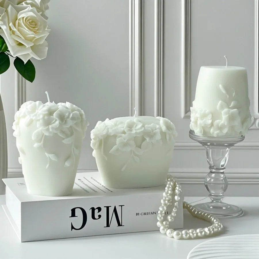 LAQTA Nordic Floral scented candle in a glass container with a floral design, emitting a warm glow.