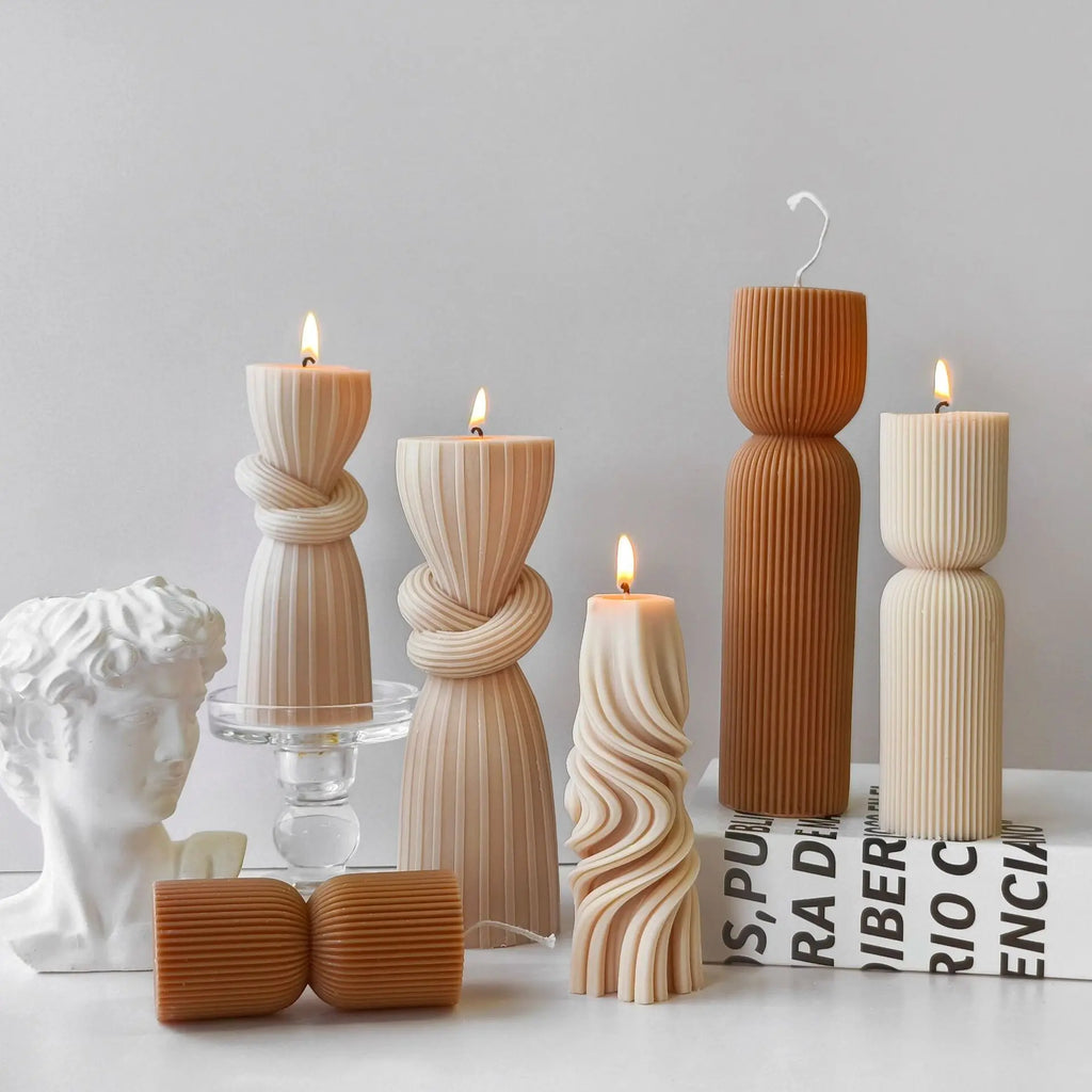 Striped cylinder aroma candle silicone mold by LAQTA, showing the detailed striped design and flexible silicone material.