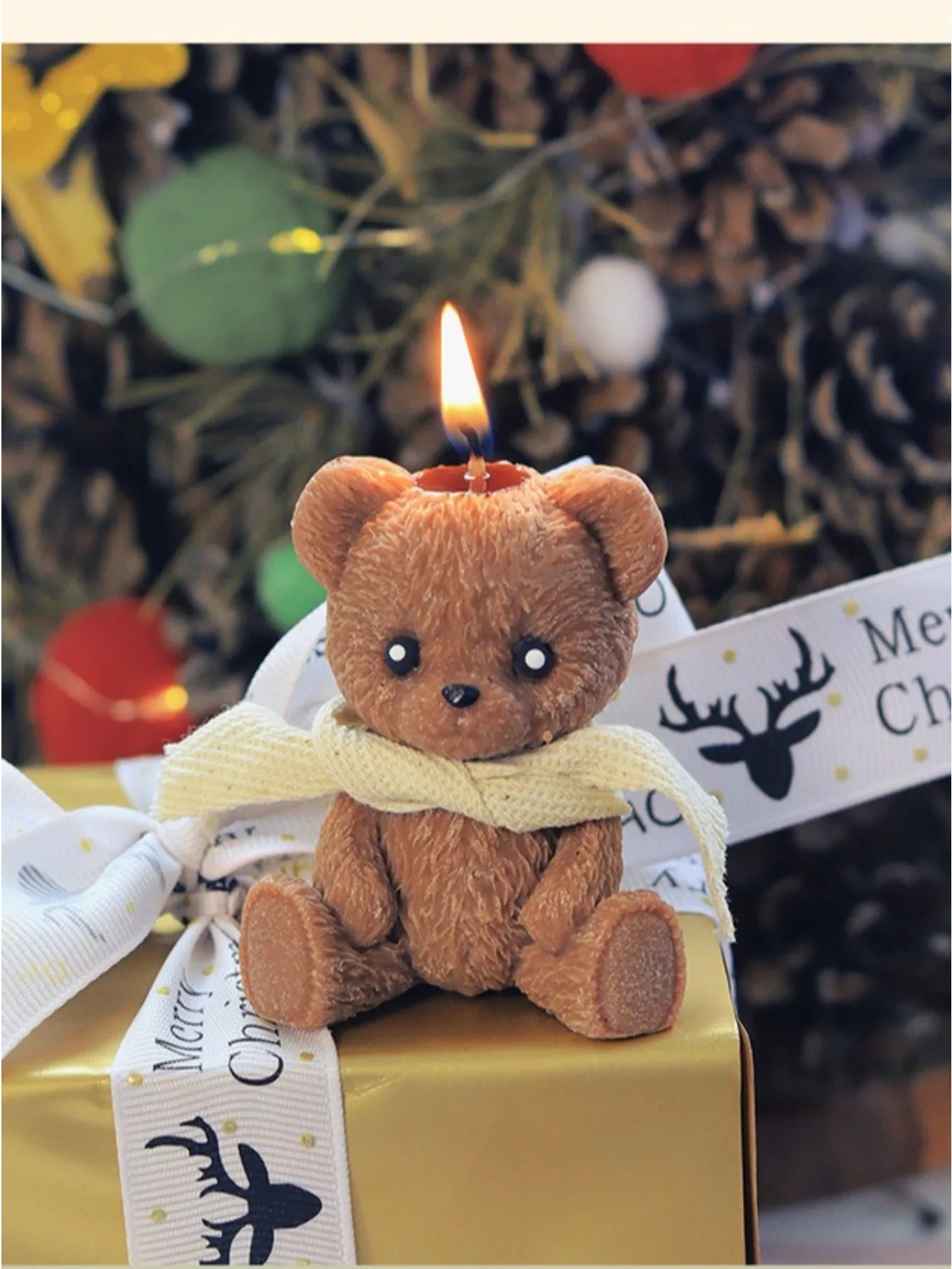 LAQTA scented candle in a cute teddy bear-shaped container, featuring a cozy scarf design and teddy bear scent.