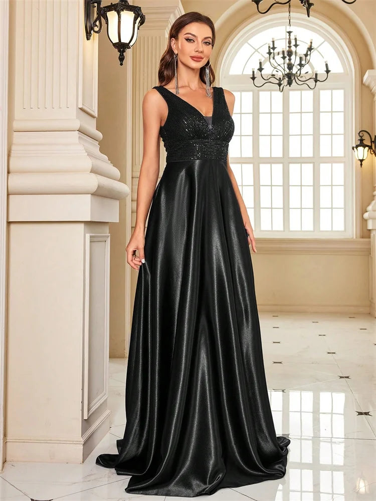 Elegant sequins evening dress by LAQTA featuring a fitted silhouette and shimmering embellishments for formal occasions.