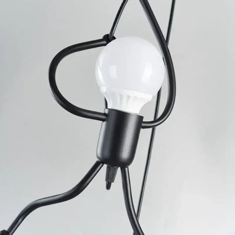 Vintage iron Little Man Pendant Light by LAQTA, showcasing a detailed, rustic pendant lamp with a playful little man design.
