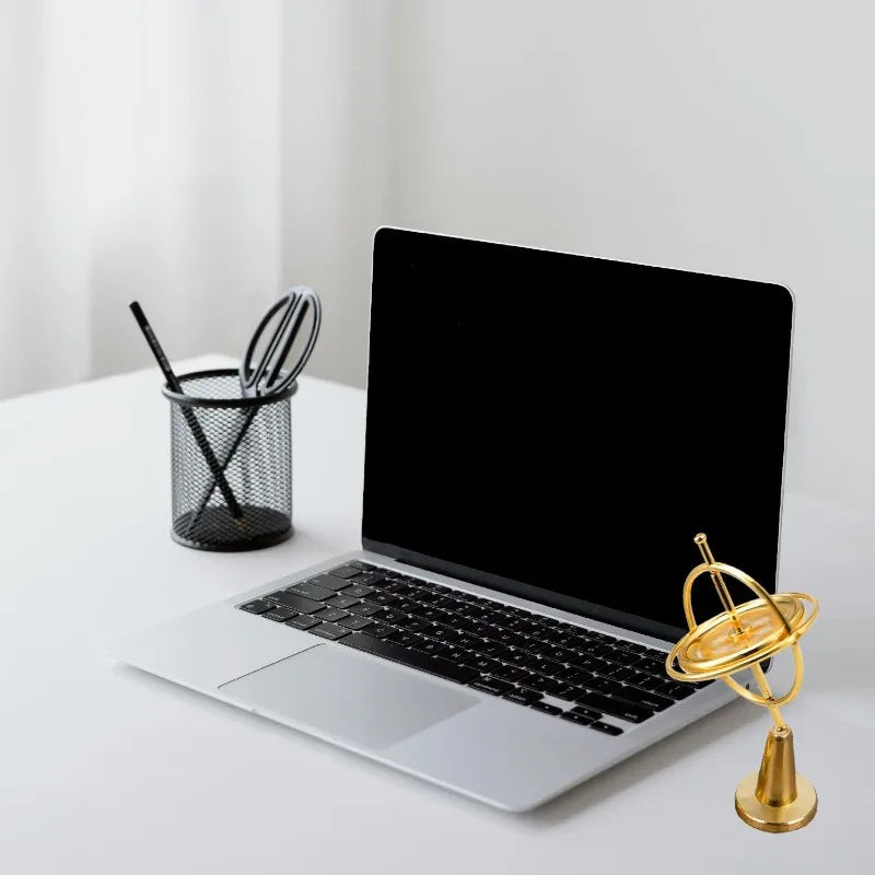 LAQTA Metal Anti-Gravity Spinning toy with shiny metallic finish and dynamic spinning motion, perfect for desk or desk decor.