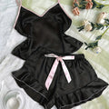 Women's satin pajama set by LAQTA featuring a smooth V-neck T-shirt and matching shorts for comfortable sleepwear.