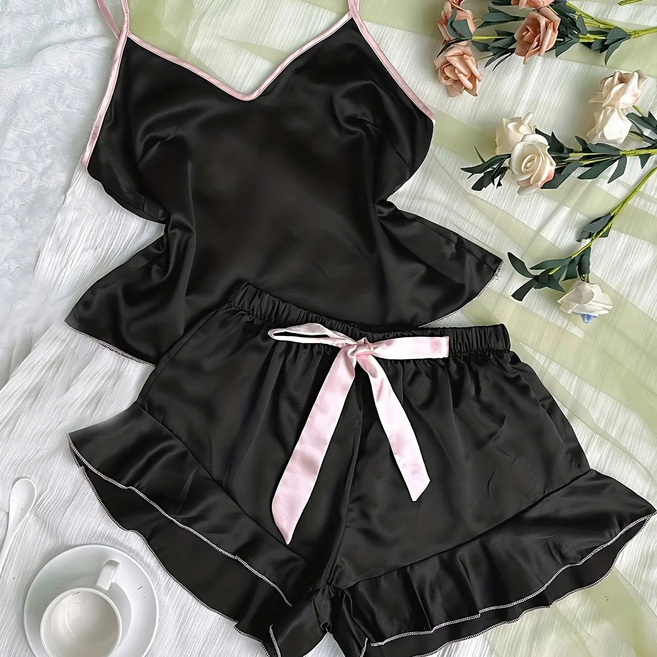 Women's satin pajama set by LAQTA featuring a smooth V-neck T-shirt and matching shorts for comfortable sleepwear.