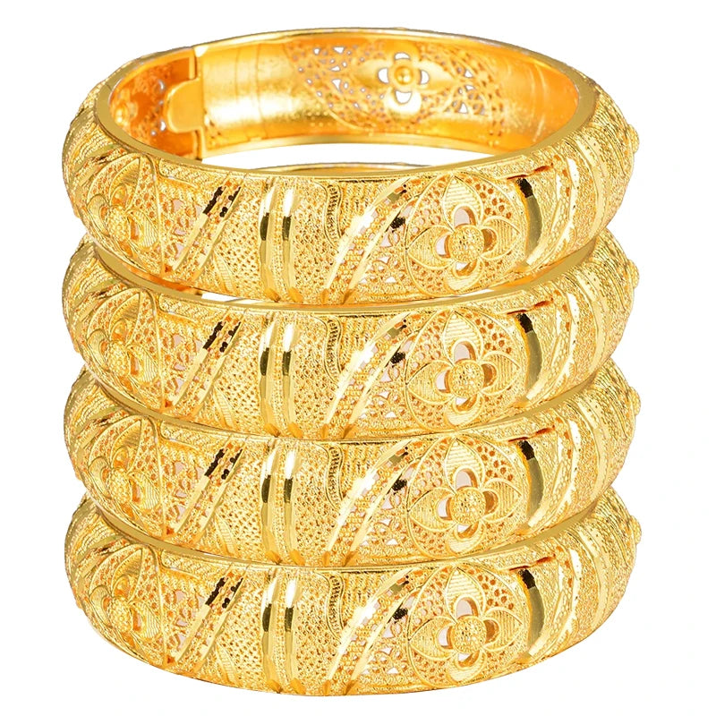 24k Dubai gold color bangles from LAQTA with intricate design, showcasing shiny gold finish and traditional jewelry style.