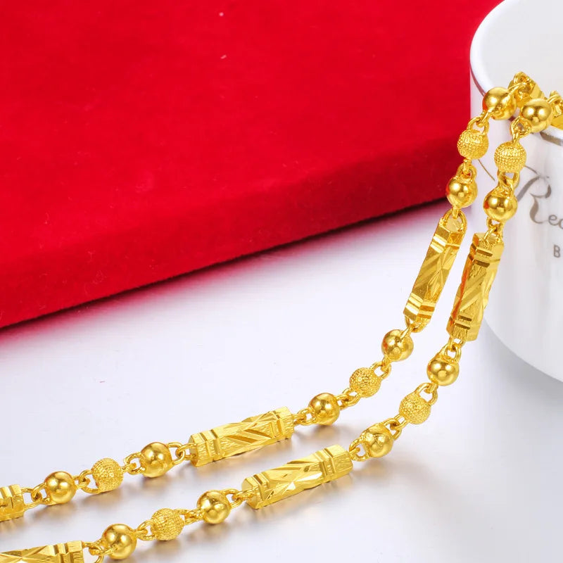 Electroplated 18K gold necklace by LAQTA featuring a sleek, elegant chain design on a neutral background.