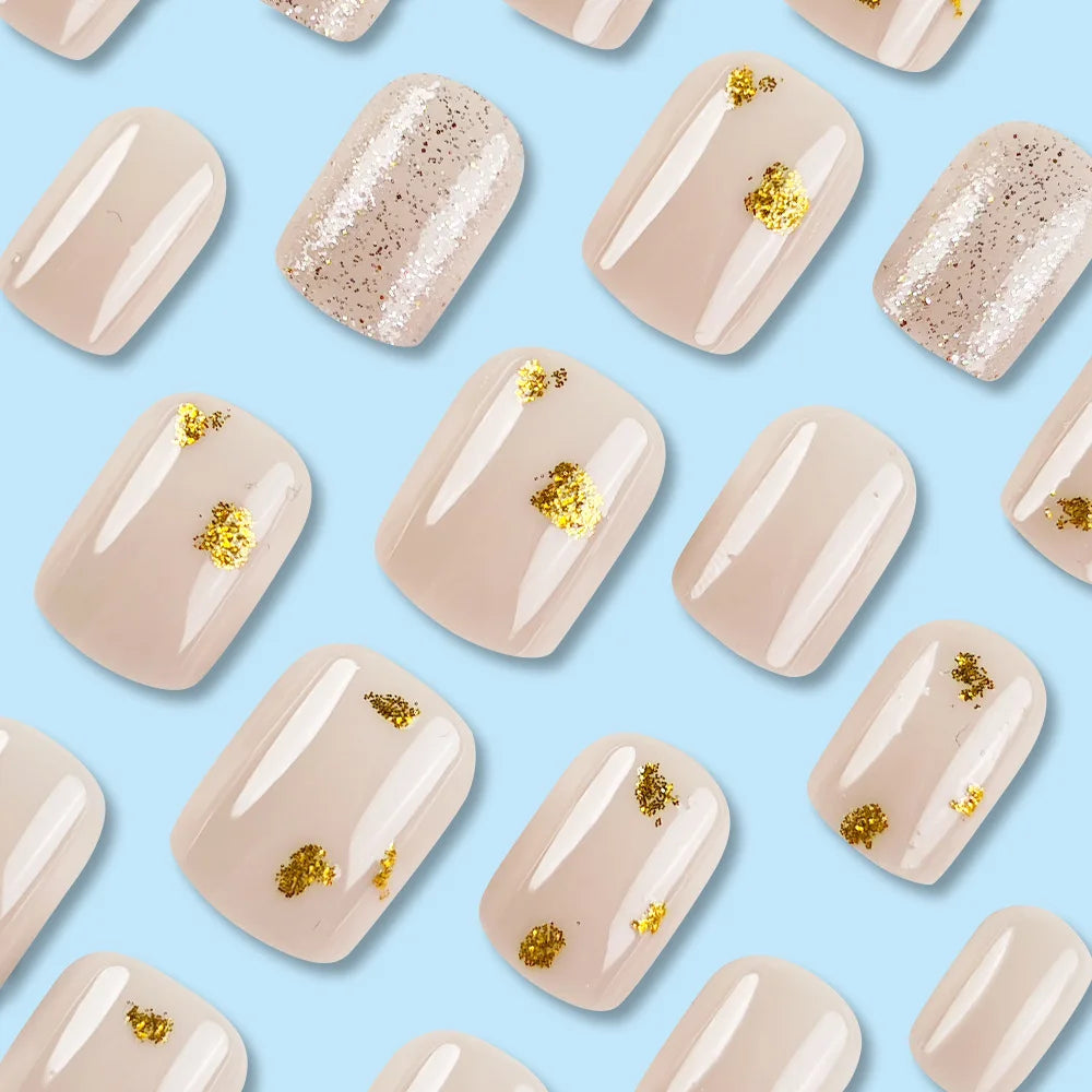Short square fake nails by LAQTA, featuring a sleek, natural look with a smooth finish on a white background.