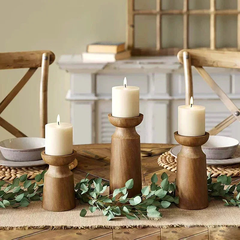 Natural wooden candlestick holders by LAQTA, showcasing minimalist design and smooth wood finish for elegant candle display.
