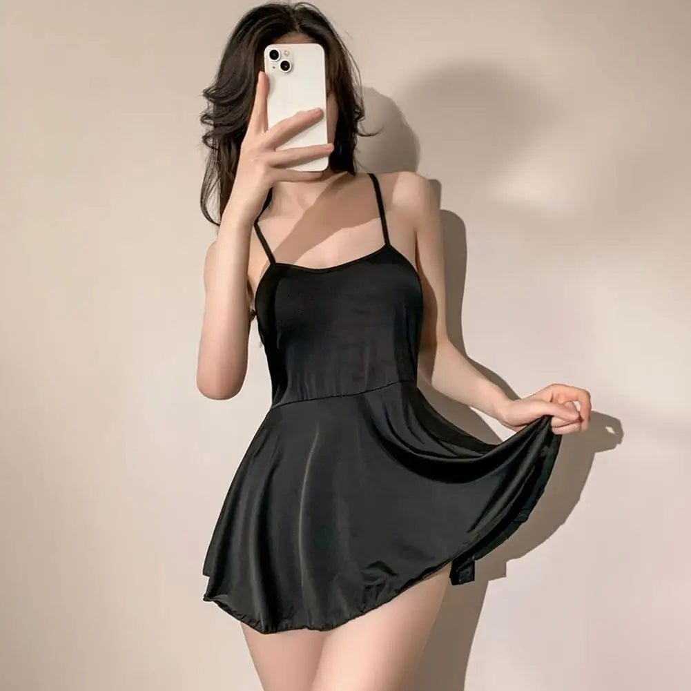 Black pleated micro dress by LAQTA featuring a fitted bodice and short length, perfect for stylish evening wear.