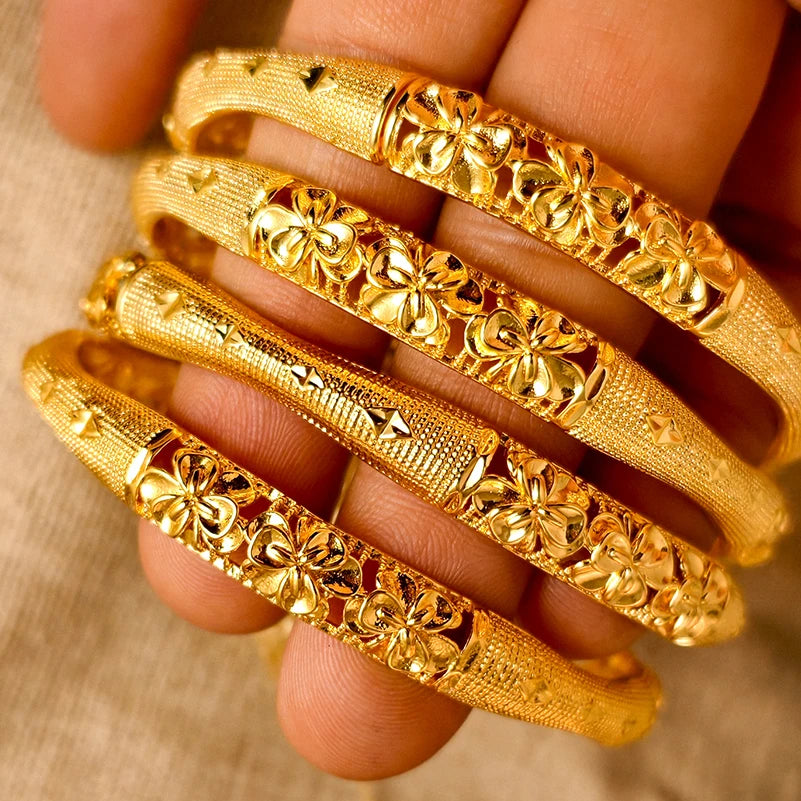 LAQTA 24k Dubai gold color bangles with intricate design, showcasing shiny gold finish and traditional jewelry style.
