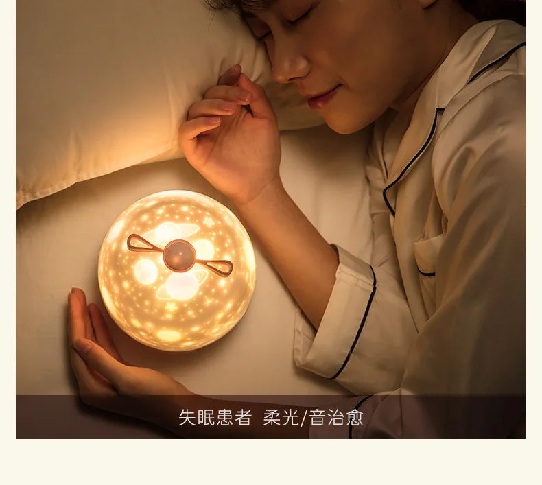 LAQTA Starry Projector Night Light displaying a starry sky projection on a wall with soft, calming lighting.