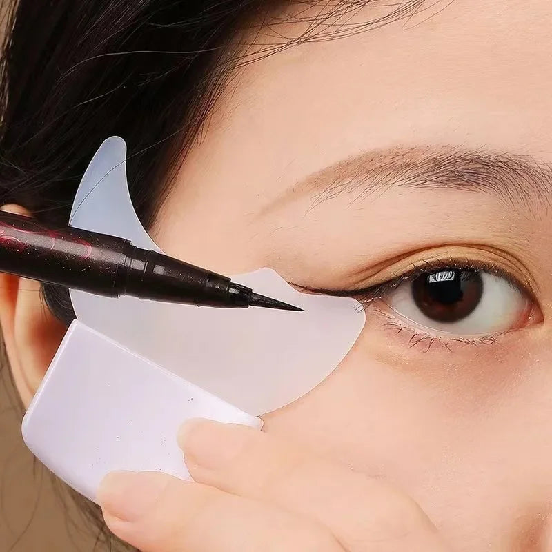 LAQTA multi-functional eyeliner stencil with wing tip designs, showing various stencil shapes on a white background.