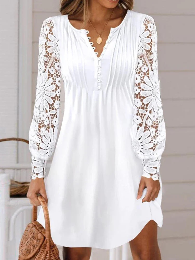 Elegant summer dress by LAQTA featuring a flowing fabric, sleeveless design, and vibrant floral pattern on a light background.