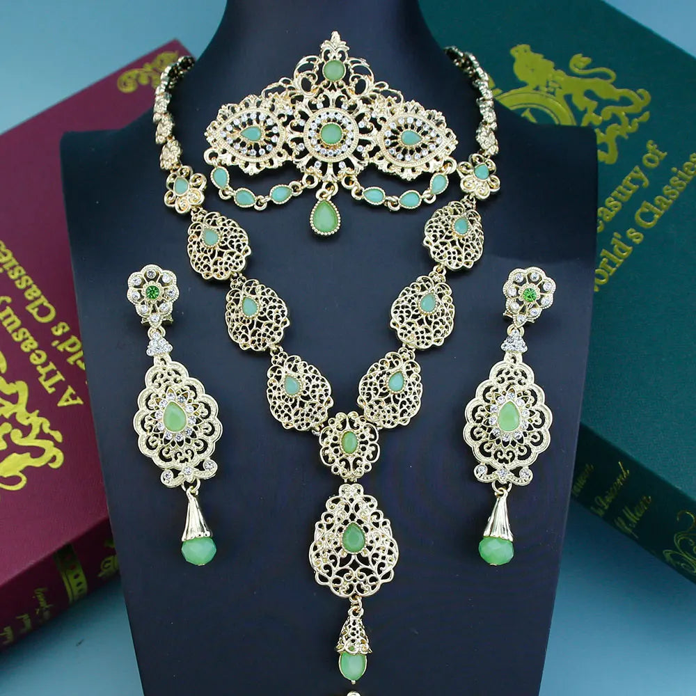 Elegant Arabic bride jewelry set by LAQTA featuring intricate gold and gemstone designs, perfect for traditional wedding attire.