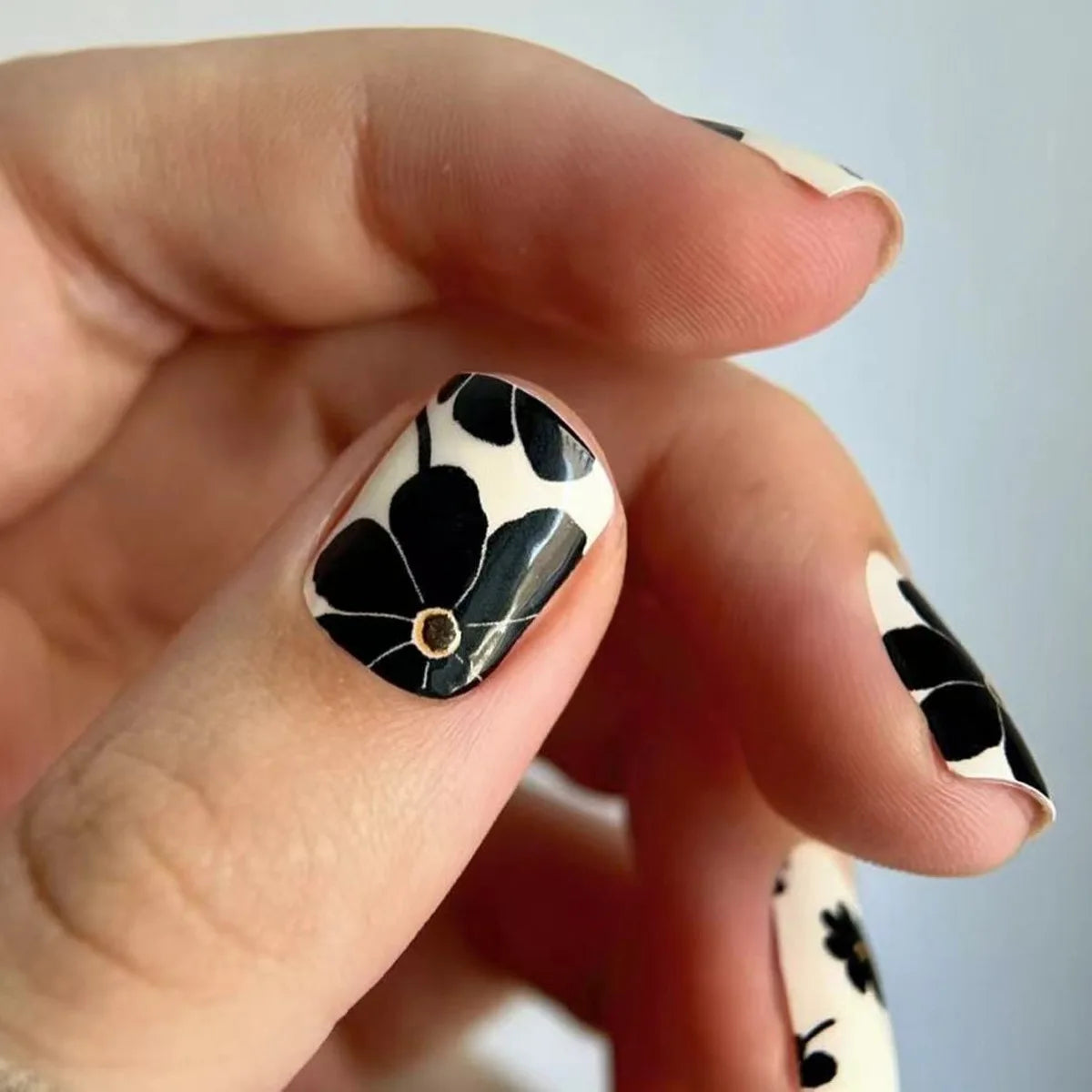 Short square fake nails by LAQTA, showcasing a stylish set with a smooth, glossy finish and natural nail shape.