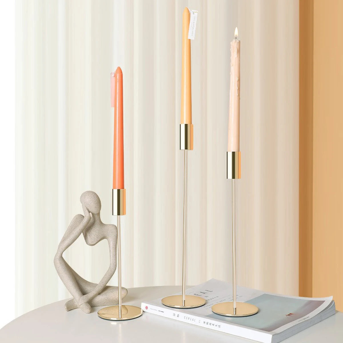 Elegant gold candlestick holder by LAQTA with a sleek design, perfect for decorative and functional use in home decor.
