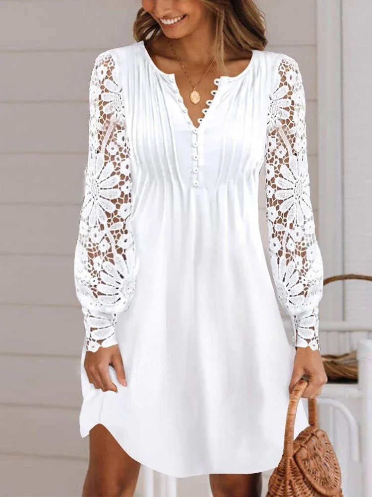 Elegant summer dress by LAQTA featuring a flowy fabric, sleeveless design, and bright floral pattern on a model.