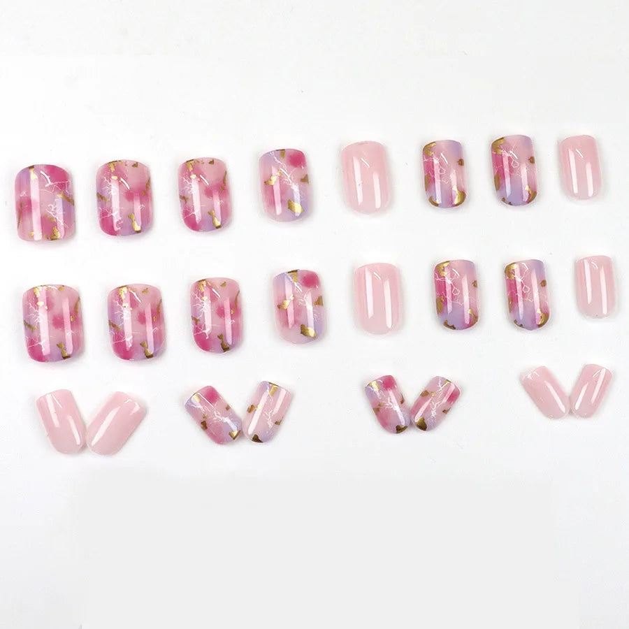 Set of 24 short square acrylic nails from LAQTA, showcasing neatly arranged nail tips in a natural finish.