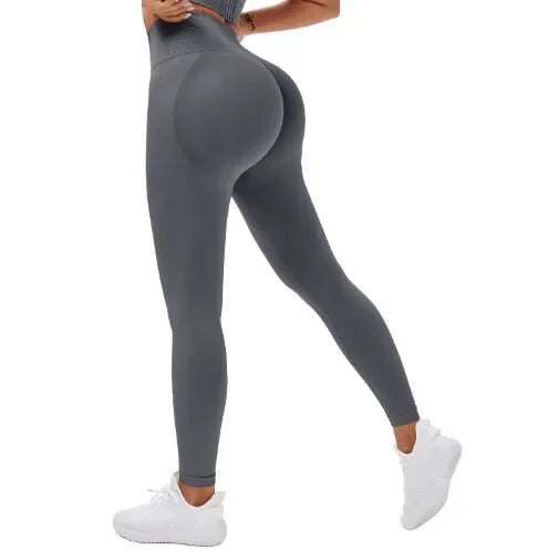 LAQTA seamless knitted gym leggings pants in black, showing a close-up of the stretchy, form-fitting fabric and high waistband.