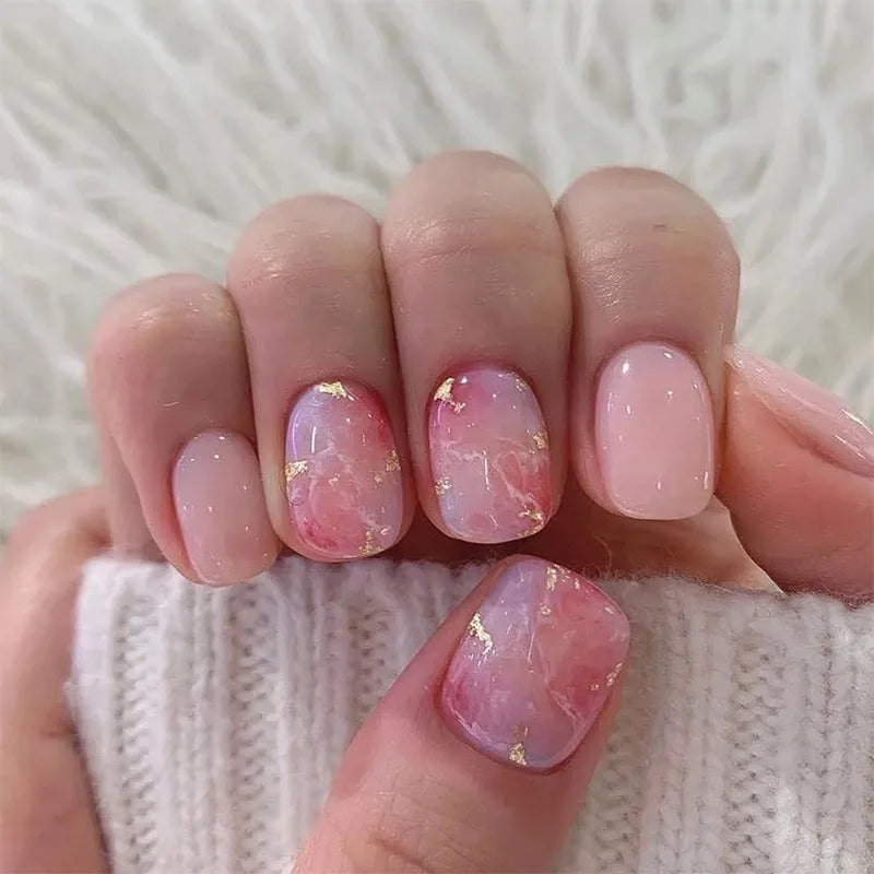 Set of 24 short Saure nails by LAQTA, neatly arranged, showcasing various sizes and natural finish for nail art and manicure.