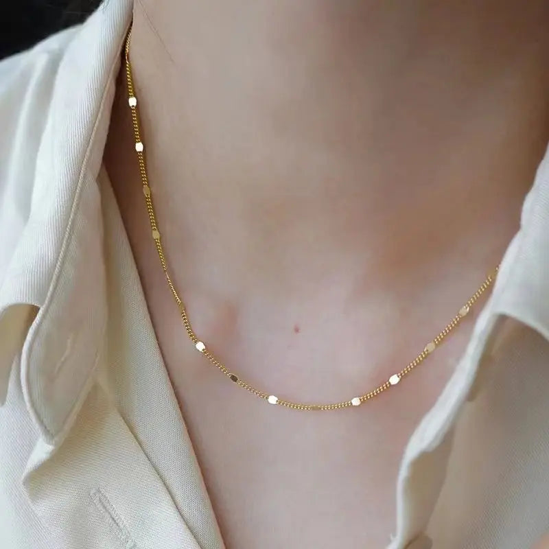 Sterling silver women's necklace by LAQTA featuring a sleek, elegant chain design on a plain background.