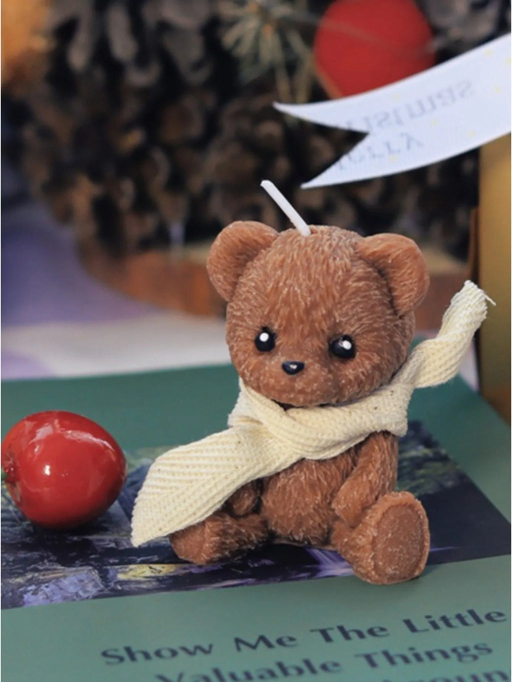 LAQTA Cute teddy bear scented candle wrapped in a cozy scarf, designed for a charming and aromatic home decor accent.